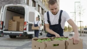 man loading fruit into van