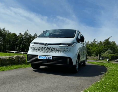 single refrigerated van driving on the road